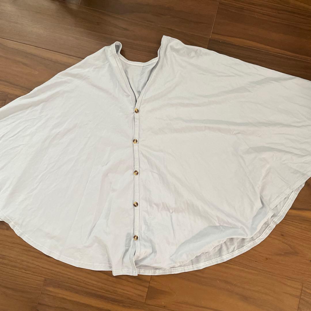 white scarf with buttons, no sleeves 