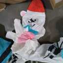 nflatable arch with snowman soldiers on both ends and a polar bear, blue snowflake, and cute Santa penguin in the middle of the archway