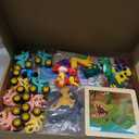 128PCS Dinosaur Party Favors for Kids, Dino Birthday Goodie Bags Set with Puzzles, 50 Stickers, Keychains, Fridge Magnets, Acrylic Crystal Dinosaurs, Dino Pull-Back Cars, Bookmarks & Burlap Gift Bags