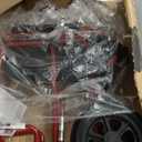 Medline Lightweight Foldable Transport Wheelchair with Handbrakes and 12-Inch Wheels, Red Frame, Black Upholstery