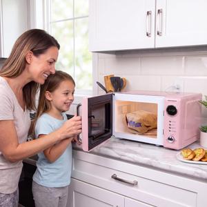 Nostalgia Countertop Microwave Oven with Easy Clean Interior - Retro Microwave with LED Display & Child Lock- Compact 0.7 Cu. Ft. Oven With 12 Pre-Programmed Settings for Quick Cooking- 700-Watts-Pink
