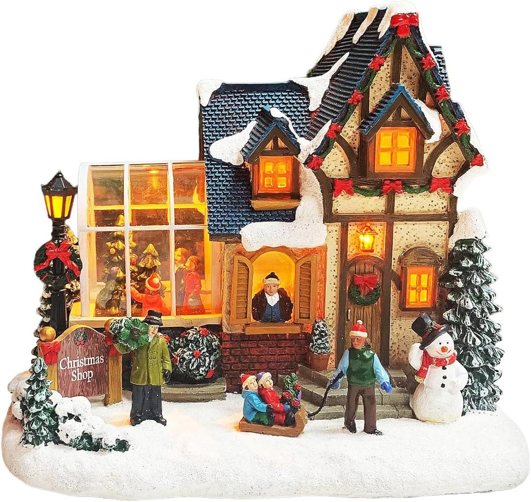 MOMENTS IN TIME Christmas Village Building Lighted Christmas Shop with LED Lights, Music & Snowman Battery Operated or Plug-in Vintage Holiday Village House Dcor 8.5H x 9.8W x 6.9D