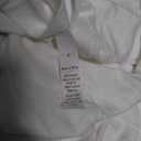 white scarf with buttons, no sleeves 