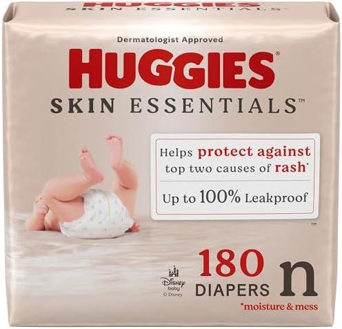 Huggies Size Newborn Diapers, Skin Essentials Baby Diapers, Size Newborn (6-9 lbs), 180 Count (3 Packs of 60), Packaging May Vary