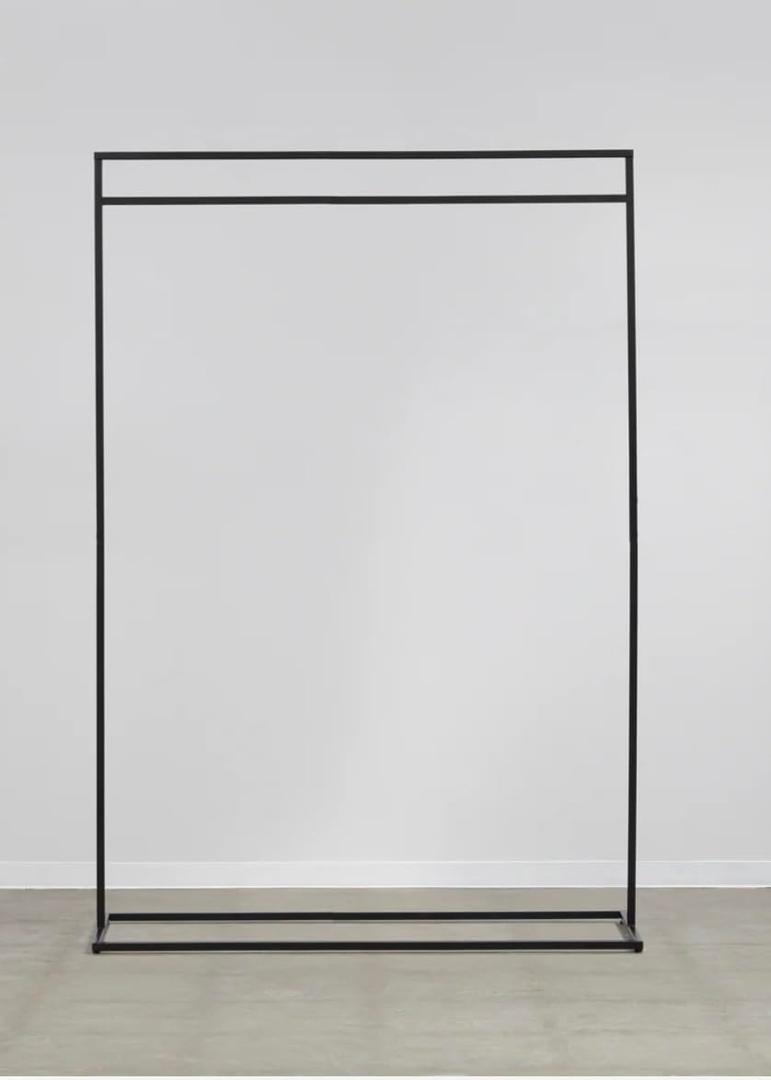 STEEL CLOTHING RACK - W110,With its minimalist, picture-frame-like design, this matte-textured steel rack fits seamlessly into any space (Black) FNT-FHGR-1100-BK