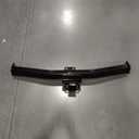 Heavy-duty black powder-coated steel trailer hitch receiver featuring a welded square cross tube, integrated safety chain loops. Designed for towing trailers and supporting hitch-mounted accessories such as bike racks and cargo carriers. Durable corrosion-resistant finish with robust welded construction for long-lasting performance.