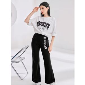 WDIRARA Girl's 2 Piece Outfits Letter Graphic Print Half Sleeve T Shirt and Flare Leg Pants Set, Black & White, 10Y