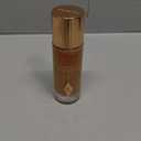 Charlotte Tilbury Hollywood FlawlessFilter - MultiUse Makeup Primer, Complexion Booster & Illuminating Liquid Highlighter with Sheer Coverage - Smooths & Blurs Skin (5.5 Tan - Neutral caramel shade for tan skin tones)