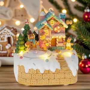 innodept12 Animated Gingerbread House Christmas Decoration  Pre-Lit Musical Resin Village Figurine with Rotating Gingerbread Characters and LED Lights for Indoor Holiday Tabletop Display