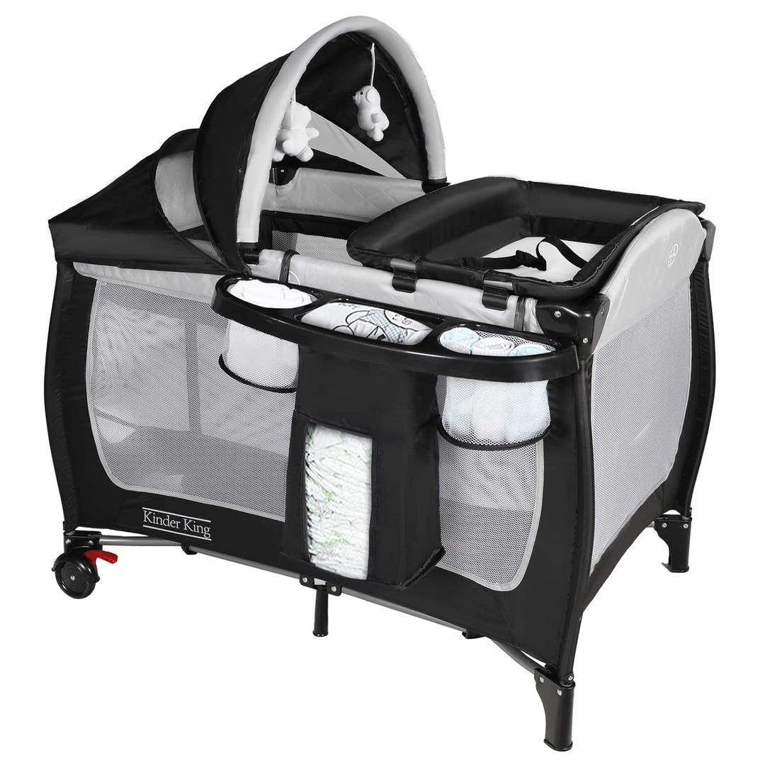 Kinder King 4 in 1 Portable Pack n Play, Baby Nursery Center Playard w/Bassinet, Large Playpen for Infant and Toddler, Newborn Changing Table, Adjustable Canopy, Storage Basket, Travel Bag, Black