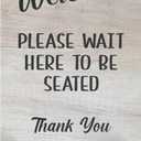 Please Wait Here To Be Seated Sign - Also as Freestanding or Adhesive Sign, ideal for cafes, restaurants or pubs (White Wood Effect Acrylic Stand)