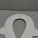 Frida Baby Fold-and-Go Portable Potty Seat for Toilet, Foldable Travel Potty Seat for Toddler, Fits Round & Oval Toilets, Non-Slip Base, Handles, Includes Free Travel Bag