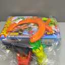 Hot Wheels Toy Car Track Set, City T-Rex Blaze Battle Playset & 1:64 Scale Die-Cast Vehicle, 18 Tall, Multiple Race Outcomes, Spinning Dinosaur Eyes