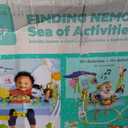 Bright Starts Disney Baby Finding Nemo Sea of Activities Baby Activity Center Jumper with Interactive Toys, Lights, Songs & Sounds, 6-12 Months (Blue)