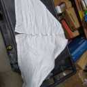 white scarf with buttons, no sleeves 