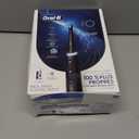 Oral-B iO Series 5 Rechargeable Electric Toothbrush with Visible Pressure Sensor to Protect Gums, 2 Minute Timer, 5 Cleaning Settings, 1 Replacement Toothbrush Heads, and Travel Case, Black