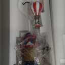 MOMENTS IN TIME Christmas Village Sky High Hot Air Balloon Rides 12.2H Animated Lighted Musical Scene Battery Operated Polyresin Holiday Dcor Festive Tabletop Collectible Gift