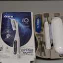 Oral-B iO Series 5 Rechargeable Electric Toothbrush with Visible Pressure Sensor to Protect Gums, 2 Minute Timer, 5 Cleaning Settings, 1 Replacement Toothbrush Heads, and Travel Case, White