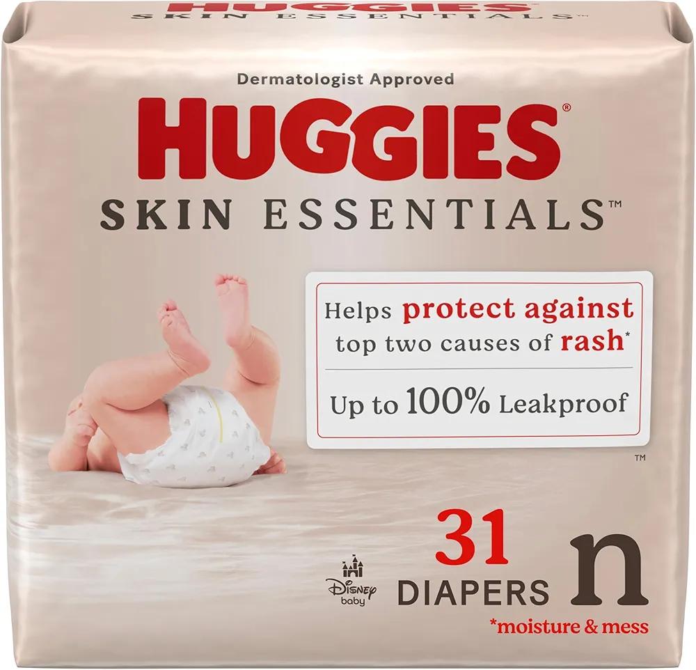 Huggies Size Newborn Diapers, Skin Essentials Baby Diapers, Size Newborn (6-9 lbs), 31 Count, Packaging May Vary