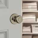 Kwikset Tylo Dummy Door Knob, Single Sided Handle for Closets, French Double Doors, and Pantry, Antique Brass Non-Turning Interior Push/Pull Door Knob, with Microban Protection (Pack of 1)