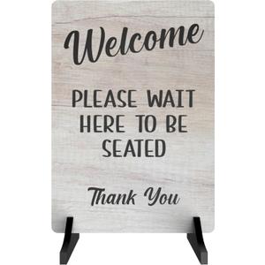 Please Wait Here To Be Seated Sign - Also as Freestanding or Adhesive Sign, ideal for cafes, restaurants or pubs (White Wood Effect Acrylic Stand)