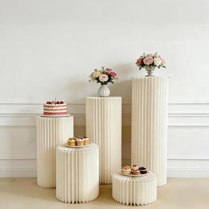 Jueraori 5 Pcs Display Cylinder Cardboard Pedestal Stands for Parties, Folding Paper Columns Pedestal Tables, Round Pillars Dessert Stands for Wedding Birthday Party Decor(Cream White)