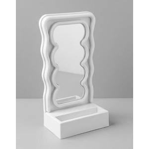 Orbit Wavy LED Light and Mirror Phone Holder is a multifunctional phone stand featuring a vibrant LED glow, a built-in mirror, and a trendy wave design for hands-free viewing