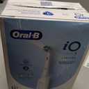 Oral-B Rechargeable Electric Toothbrush, iO3 Limited Deep Clean, 3 Cleaning Modes, Visual Pressure Sensor to Protect Gums, 2 Brush Heads, Travel Case, White