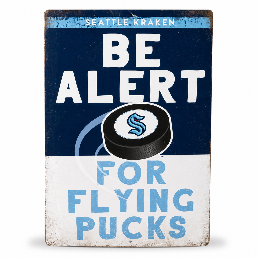 Be Alert For Flying Pucks Metal Sign