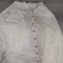 white scarf with buttons, no sleeves 