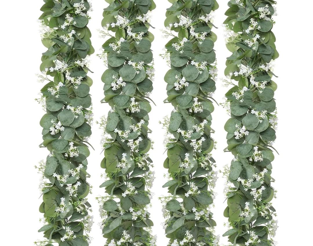 KHOYIME Eucalyptus Garland with White Flowers, 4 Packs 5.9Ft Artificial Silver Dollar Eucalyptus Leaves Plant Fake Greenery Hanging Ivy Vines Faux Wreath for Wedding Arch Party Mantle Table Home Decor