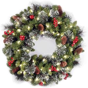 National Tree Company 24 in Pre-Lit Crestwood Spruce Artificial Christmas Wreath, Christmas Decoration with Glitter, Pinecones, Red Berries, 50 Clear LED Lights, 160 Tips, Timer, Green