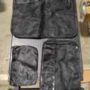 Travel Compression Packing Cube Set by the Brand Bagail. The carry bag is black and there are 8 total various packing bags of different sizes from a zip pouch to a cube the size of 18"x14"x5".