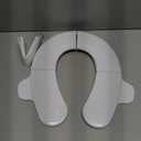 Frida Baby Fold-and-Go Portable Potty Seat for Toilet, Foldable Travel Potty Seat for Toddler, Fits Round & Oval Toilets, Non-Slip Base, Handles, Includes Free Travel Bag (Small)