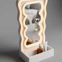 Orbit Wavy LED Light and Mirror Phone Holder is a multifunctional phone stand featuring a vibrant LED glow, a built-in mirror, and a trendy wave design for hands-free viewing