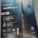 Philips Sonicare 7300 Series Electric Toothbrush - Next-Generation Sonicare Technology, Pressure Sensor, 12 Brushing Settings, SmarTimer, BrushPacer, 21-Day Runtime, Travel Case, Black, HX7421/07