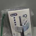 OralB iO Series 6 Rechargeable Electric Toothbrush with Visible Pressure Sensor to Protect Gums, 2 Minute Timer, 5 Cleaning Settings, 1 Replacement Toothbrush Head, and Travel Case, Black