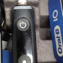 Oral-B iO Deep Clean + Protect Rechargeable Electric Toothbrush, Black with a iO Series 7 Toothbrush, 2 Replacement Brush Heads, and a Charging Travel Case