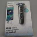 Philips Norelco Shaver 7300, Rechargeable Wet & Dry Electric Shaver with SenseIQ Technology, Pop-up Trimmer, Charging Stand, Click-on Nose Trimmer, & Travel Case, S7887/92 (Dark Chrome)