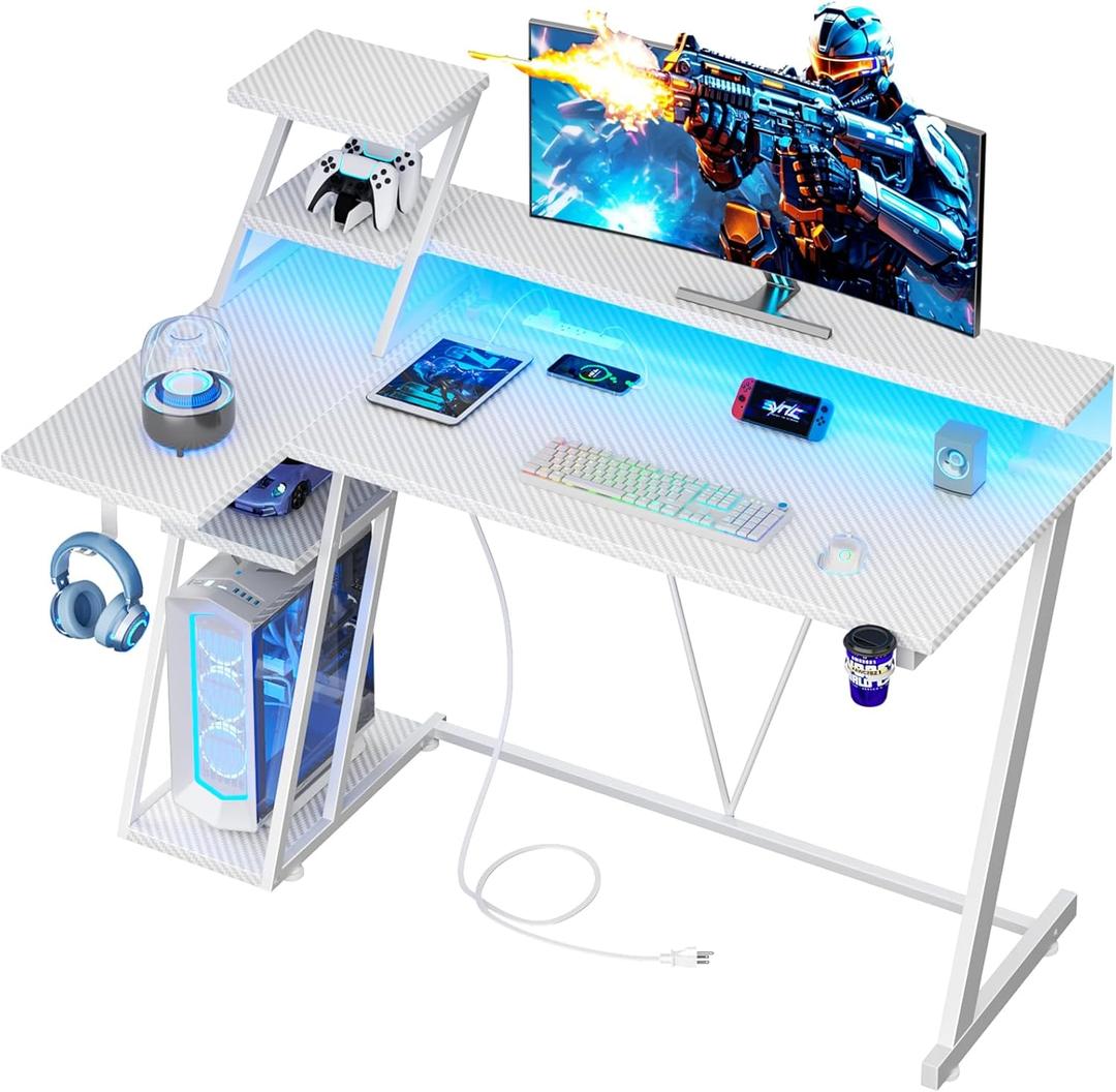 47 Inch White Gaming Desk with LED Lights & Power Outlet, L Shaped Gaming Table with Storage Shelves, Gamer Workstations with Monitor Stand for Bedroom (Carbon Fiber White)