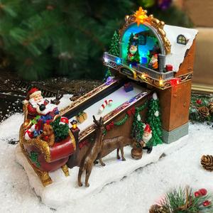 MOMENTS IN TIME Animated Santas Toy Shop Conveyor Belt Lighted Christmas Village Building with LED Lights, Music & Moving Sleigh Scene Plug-In Power Adapter Included
