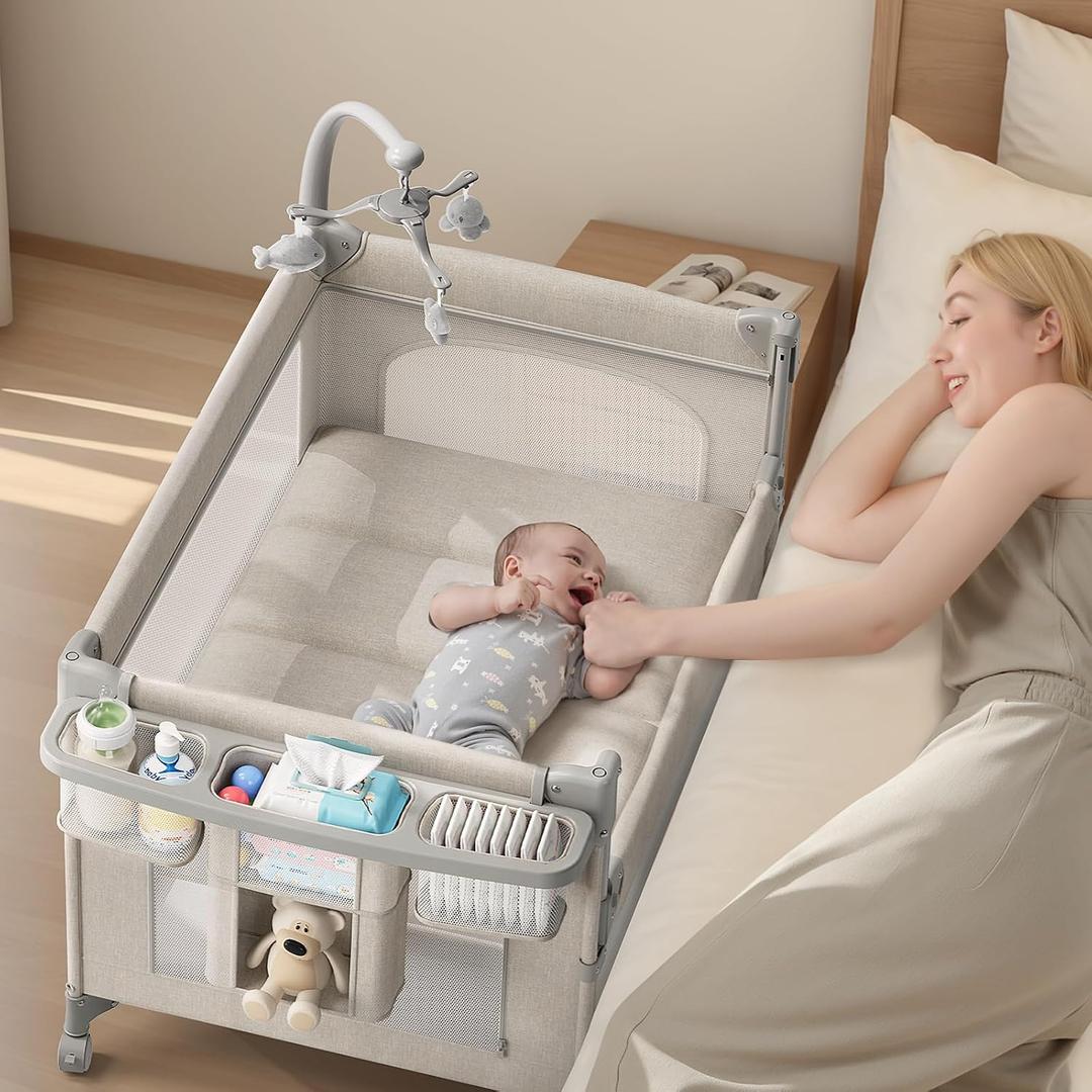 TinyGlow Baby Bassinet, Pack and Play, Bedside Crib Sleeper, Diaper Changer
Quickly Assembles and Folds, Portable Crib with Mattress,Mosquito Net and Toys Bar, Easy to Carry for Newborn to Toddler