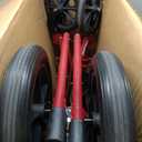 Medline Lightweight Foldable Transport Wheelchair with Handbrakes and 12-Inch Wheels, Red Frame, Black Upholstery