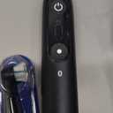 Oral-B Rechargeable Electric Toothbrush, iO9 Genius, 7 Cleaning Modes, Interactive Display, Charging Travel Case, Visible Pressure Sensor, 4 Brush Heads, Black