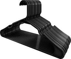 29 each plastic black used hangers with shoulder grooves