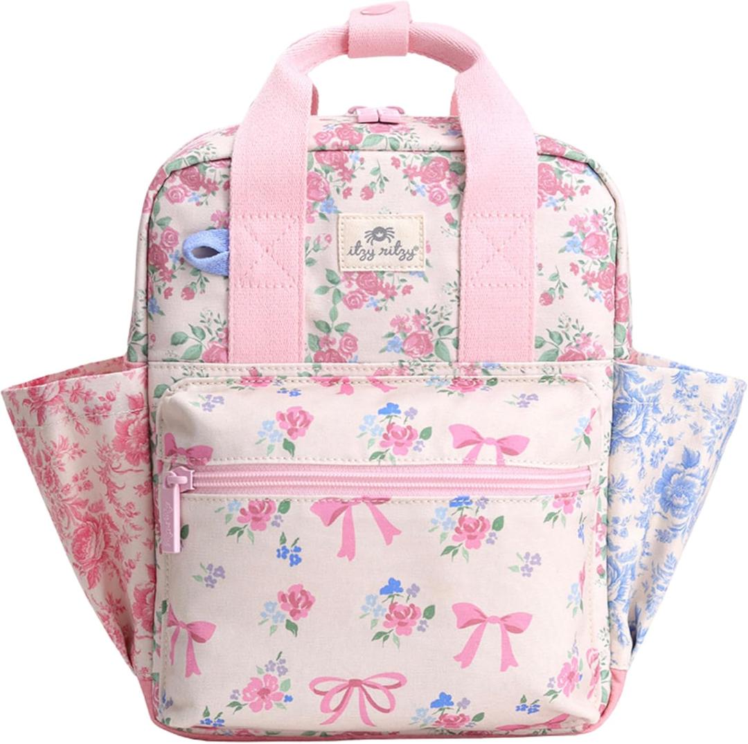 Itzy Ritzy Toddler Backpack - Daycare Bag - Features Adjustable Shoulder Straps, 2 Side Pockets & Spacious Interior with Wipeable Fabric Lining & Name Label, Ribbons & Roses Backpack (Small)