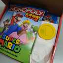 Monopoly Junior Super Mario Edition Board Game, Fun Kids' Ages 5 and Up, Explore The Mushroom Kingdom as Mario, Peach, Yoshi, or Luigi