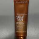 Clarins Self Tanning Milky Lotion | Self Tanner For Face and Body | Natural, LongLasting, StreakFree, SunKissed Glow and 24Hour Hydration* | NonStaining | Contains Glycerin | 4.2 Ounces