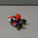 Super Mario Spin Out Mariokart Mario Racer Vehicle with 360 Spins, Wind Up and Go! Includes One 2.5 Mario Action Figure