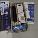 Oral-B Rechargeable Electric Toothbrush, iO2 Starter Kit, 3 Cleaning Modes, Automatic Pressure Sensor to Protect Gums, 2 Brush Heads, Night Black